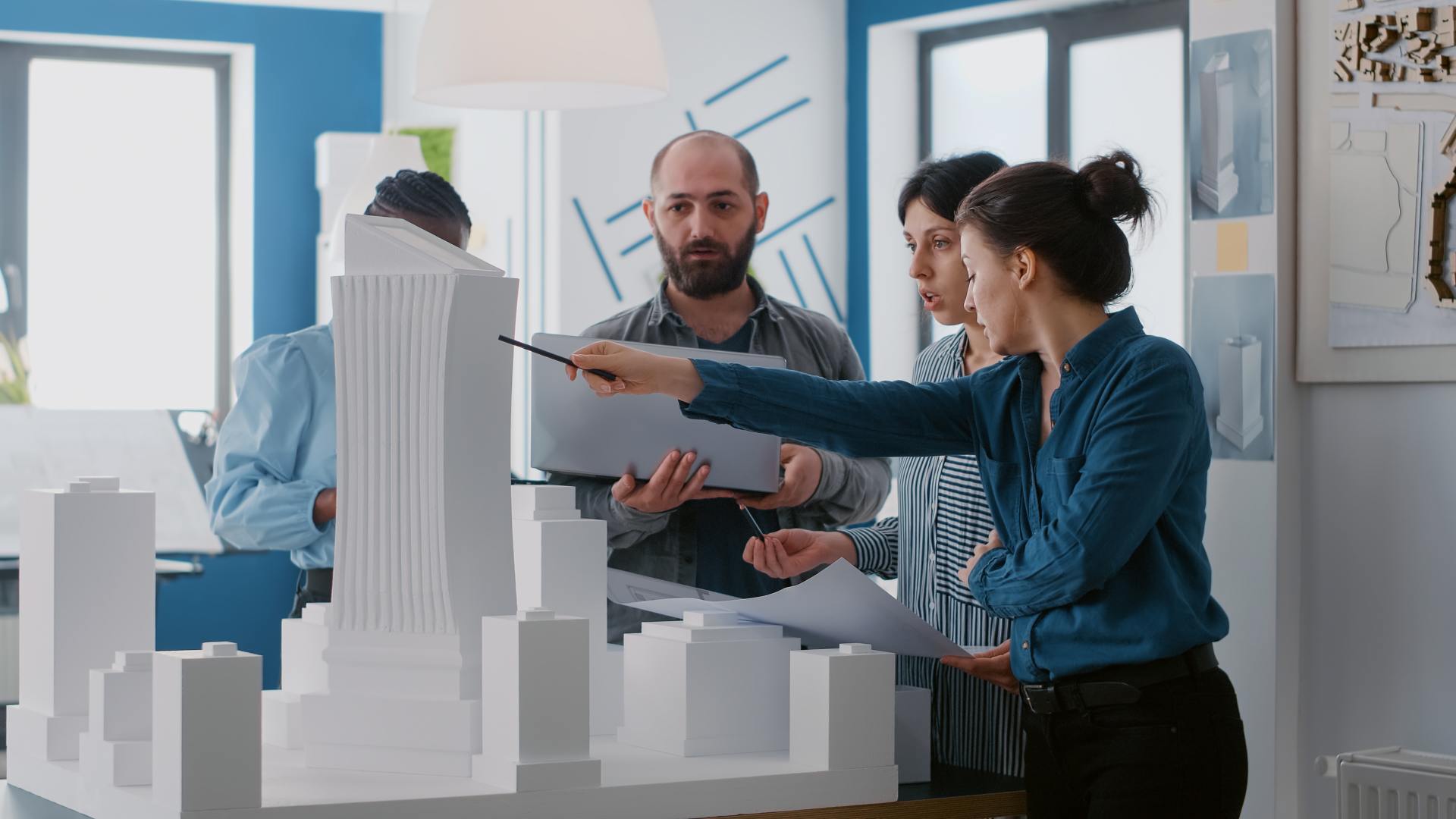 multi-ethnic-people-working-with-laptop-tablet-building-model-architecture-project-coworkers-doing-teamwork-design-maquette-construction-layout-with-blueprints (1) multi-ethnic-people-working-with-laptop-tablet-building-model-architecture-project-coworkers-doing-teamwork-design-maquette-construction-layout-with-blueprints (1)